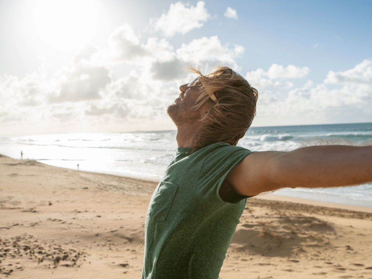 Happy man on beach