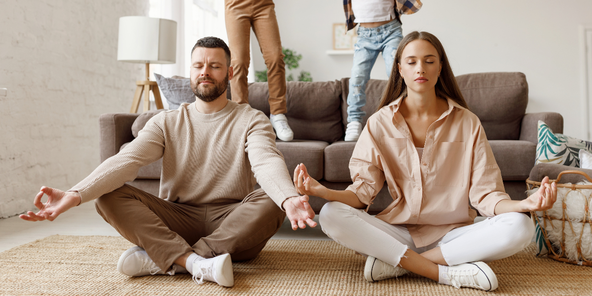 Zen parents while children play loudly and jump on sofa