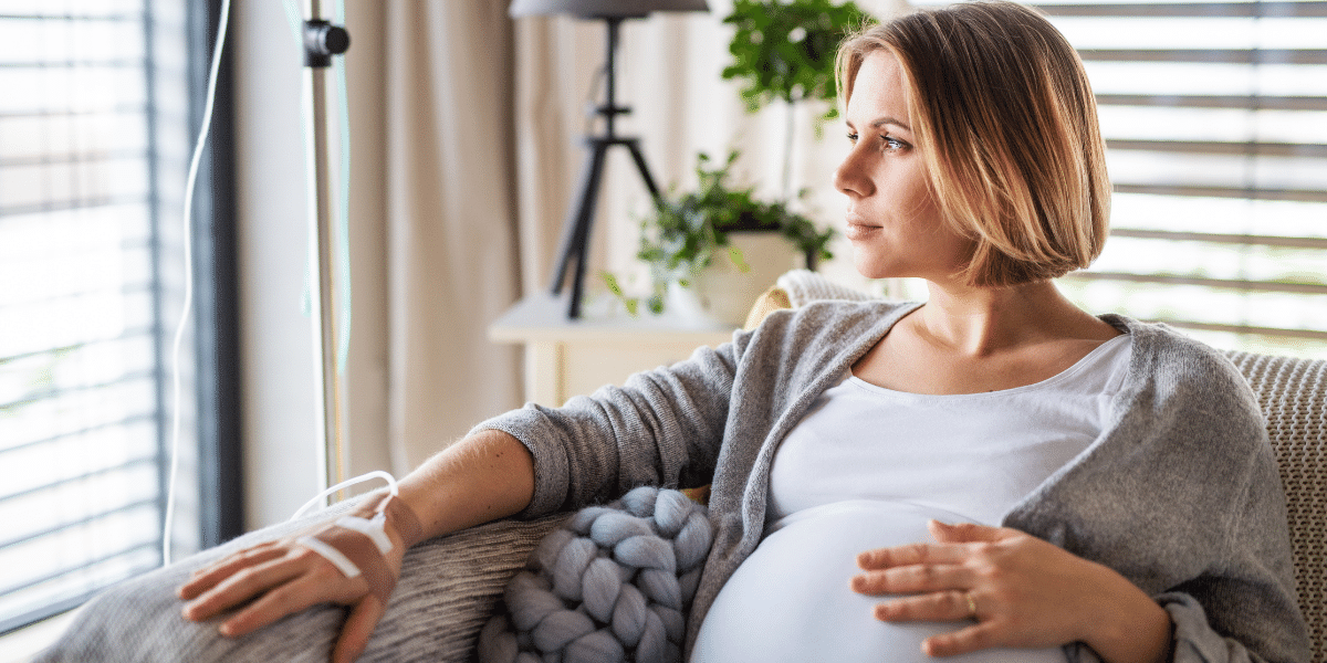 Pregnant woman receiving an IV infusion