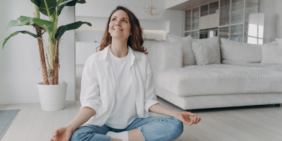 Lady smiling while meditating