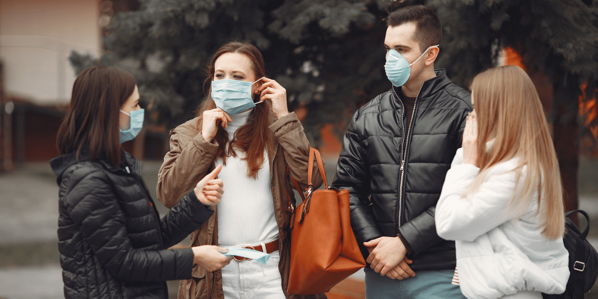 Group of friends wearing face masks