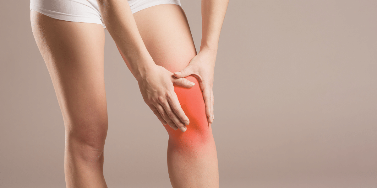 Lady holding her inflamed knee